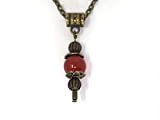 Collier pour femme avec pendentif Thurcolas de style vintage en cornaline rouge monté sur une chaine en bronze antique