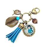 Porte Clés Bijou de Sac Cabochon Verre fillette et oiseau, bleu et marron, Métal Bronze, Pompon en Suédine, Perle Semi ...